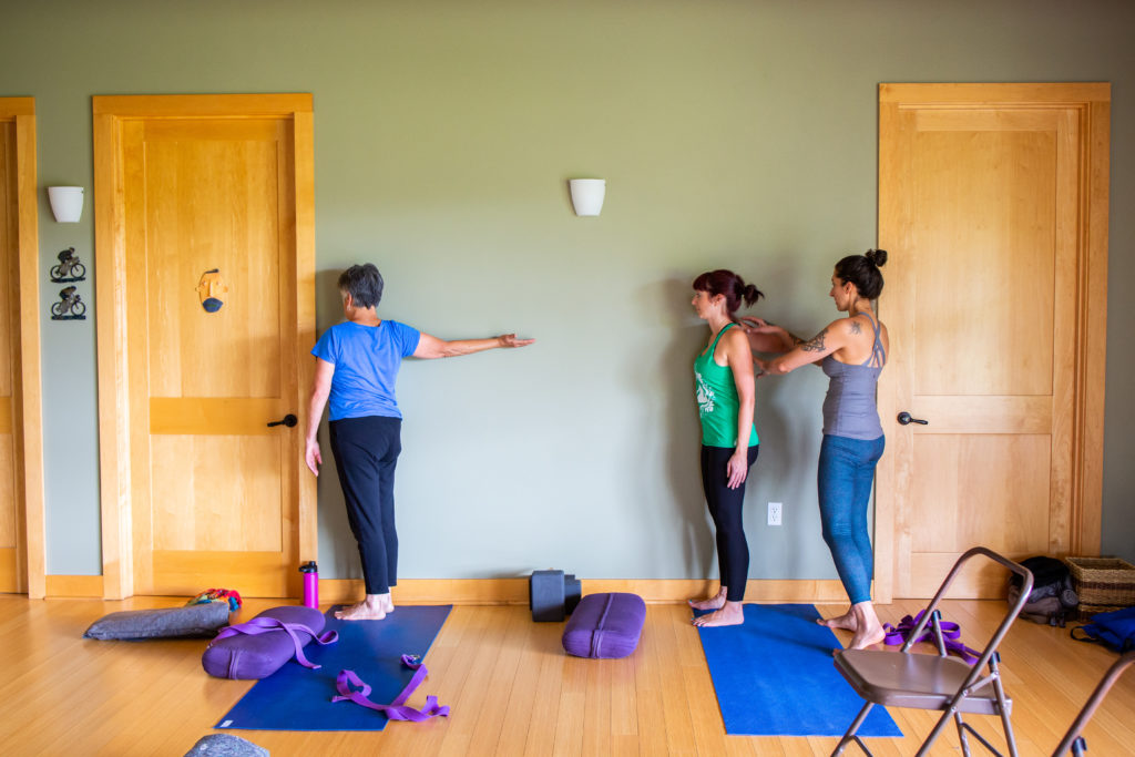 Alix with students and yoga props